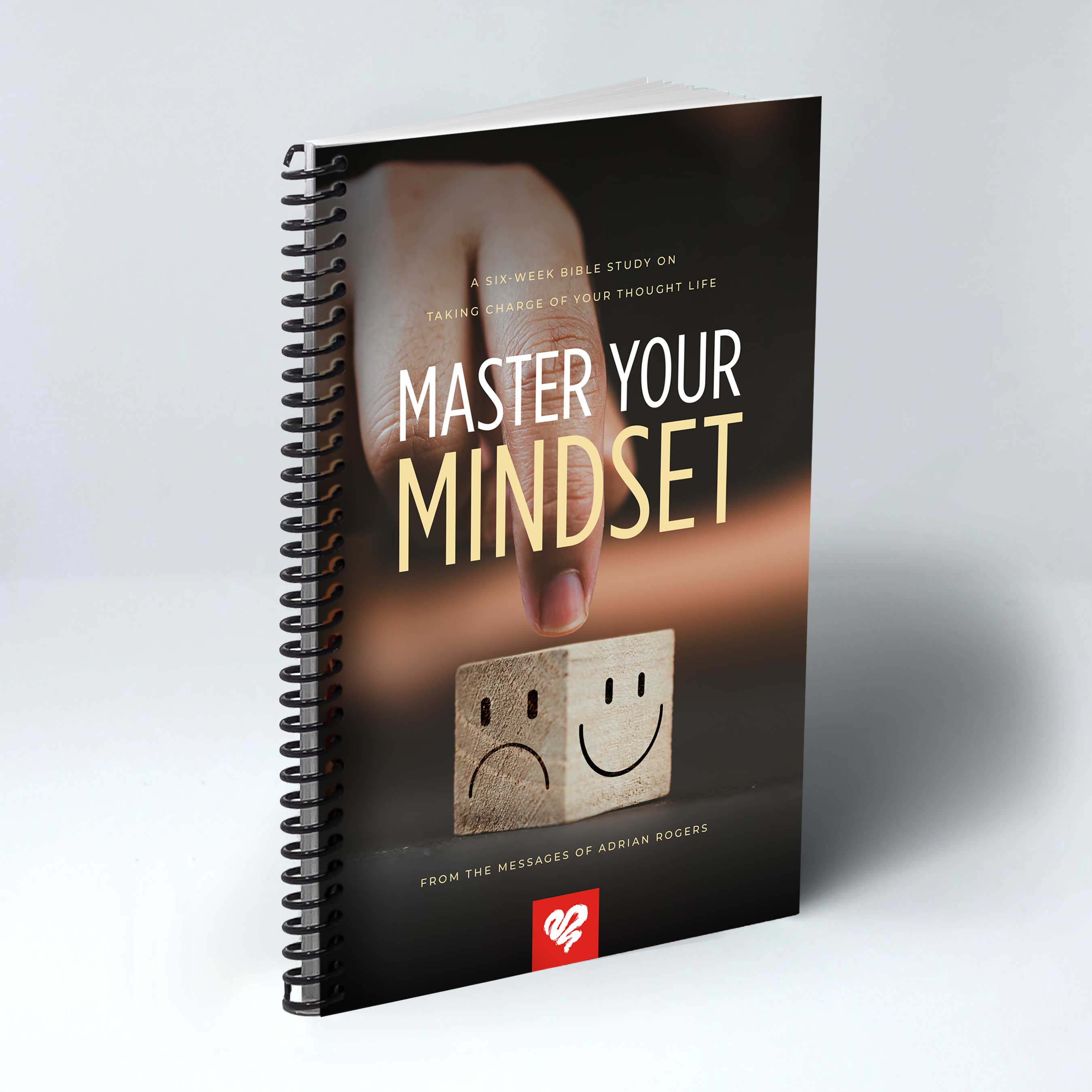 Cover of Master Your Mindset, a six-week Bible study from the messages of Adrian Rogers on taking charge of your thought life, featuring a hand flipping a wooden block from a sad face to a smiling face.